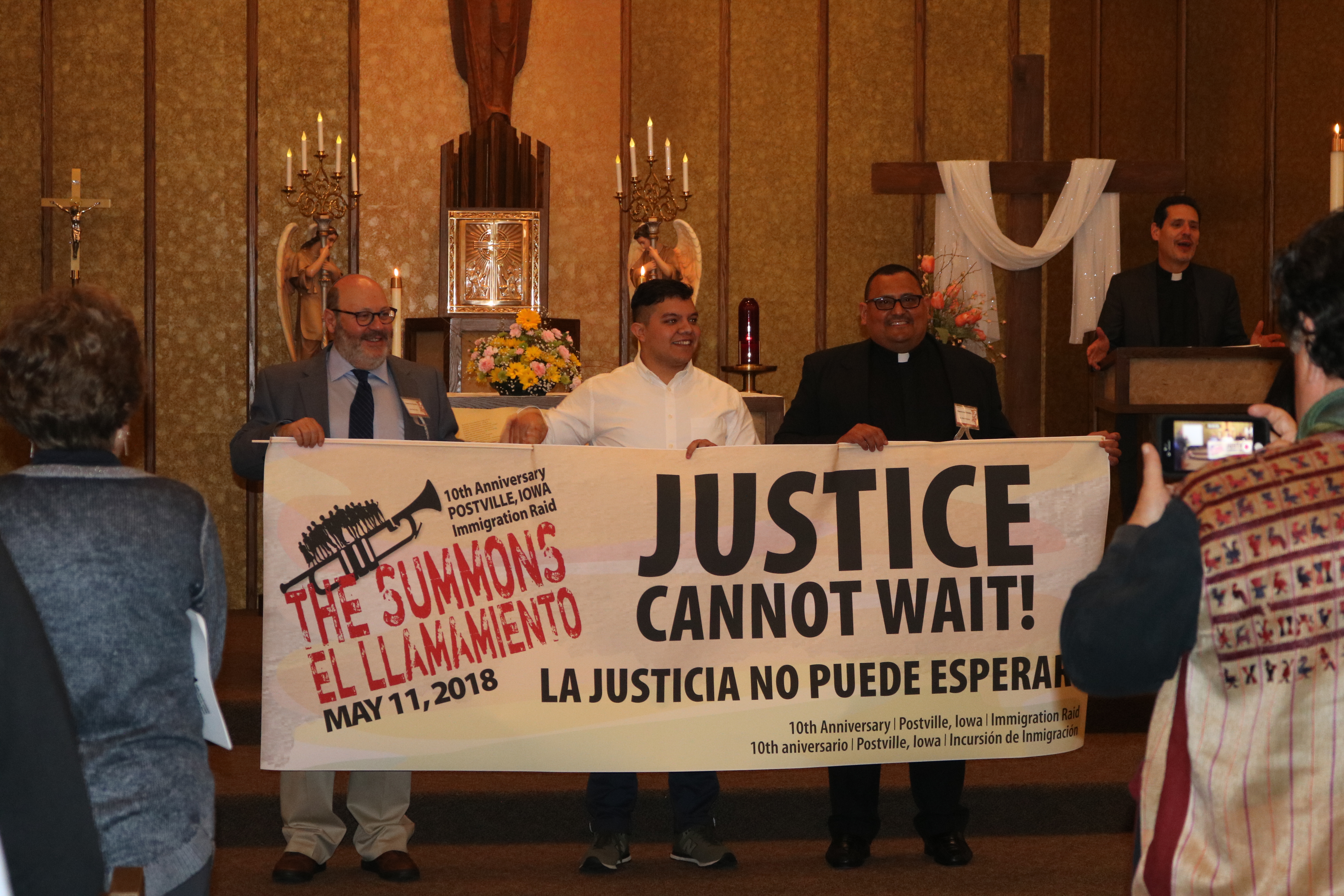 Activists at "The Summons," the interfaith gathering commemorating the Postville immigration raid.