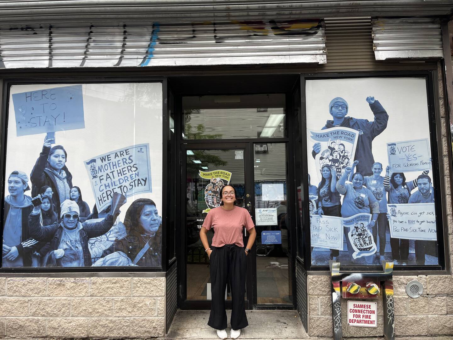 Jen Lozano, a 2023-24 Jesuit Volunteer, stands outside her service placement at Make the Road in New York City. Courtesy of Jen Lozano, Jesuit Volunteer
