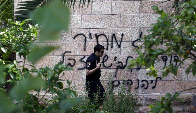 Graffito on a church in Jerusalem: "King David is for the Jews, Jesus is garbage.” (Photo by AFP)