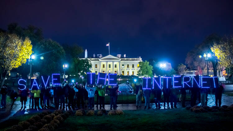 Demonstrators gather outside the White House in November 2014 to show their support for net neutrality. (Flickr/Joseph Gruber)