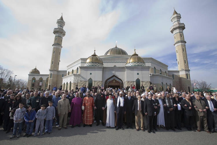 Muslim, Christian and Jewish leaders hold a prayer service and vigil at the Islamic Center of America in Dearborn, Mich.