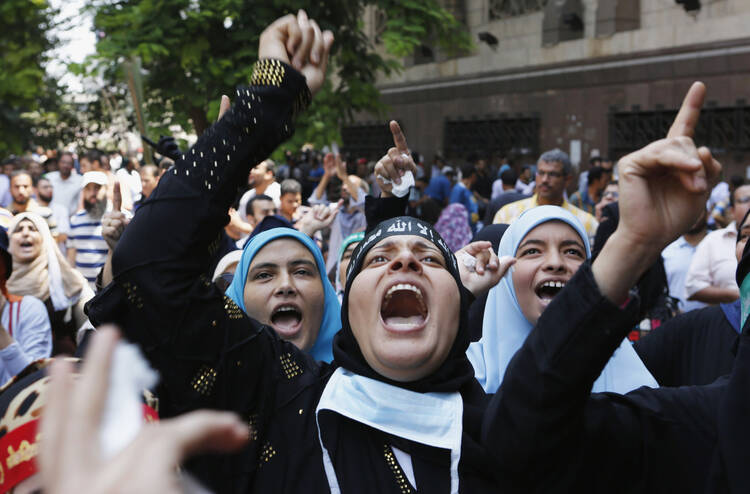 Supporters of ousted Egyptian President Mohammed Morsi take part in a protest near Ennour Mosque in Cairo Aug. 16, 2013.