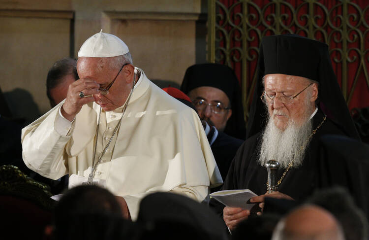 Pope Francis and Ecumenical Patriarch Bartholomew attend ecumenical celebration in Church of the Holy Sepulcher in Jerusalem. (CNS photo/Paul Haring)