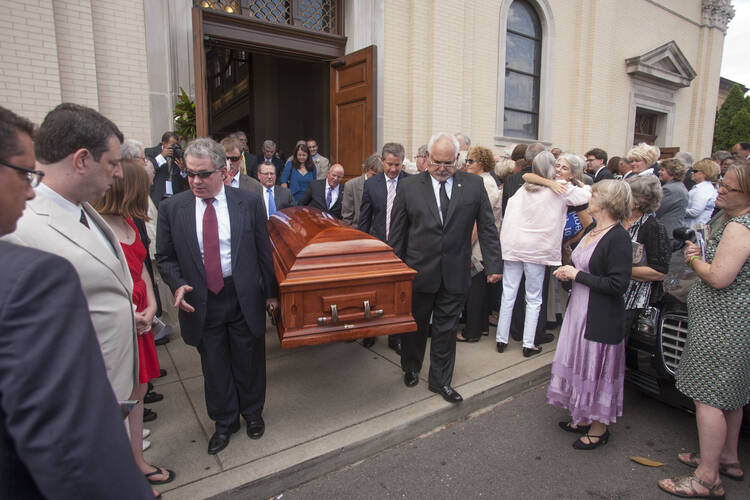 Pall bearers carry casket with body of late John Seigenthaler out of Cathedral of the Incarnation in Nashville, Tenn.