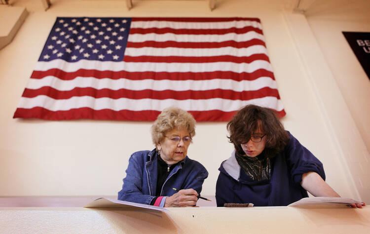 Beverly Moore helps her grandson Johnah Karman-Moore vote for the first time at Bellarmine University in Louisville, Ky., Nov. 4, during the midterm elections. (CNS photo/Mark Lyons, EPA)