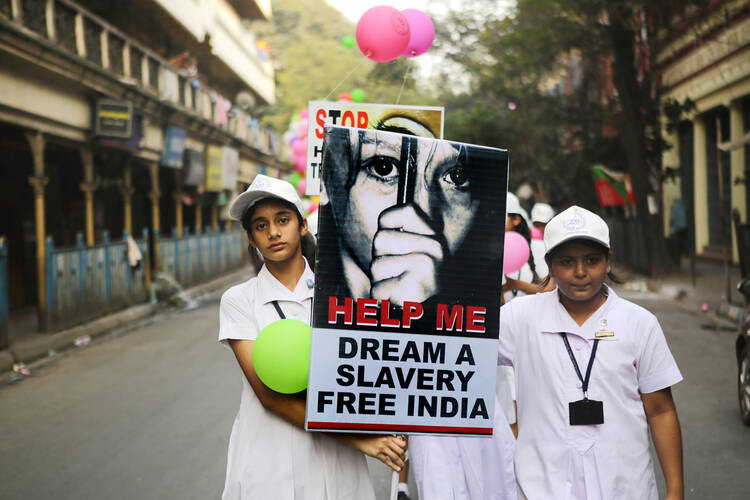 Students from the Archdiocese of Calcutta take part in a walk for peace against human trafficking in early February in Kolkatta, India. (CNS photo/Piyal Adhikary, EPA) 
