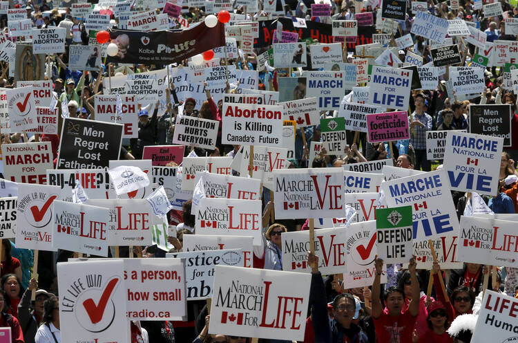Demonstrators march at a pro-life protest on Parliament Hill in Ottawa, Ontario in May 2015. (CNS photo/Chris Wattie, Reuters)