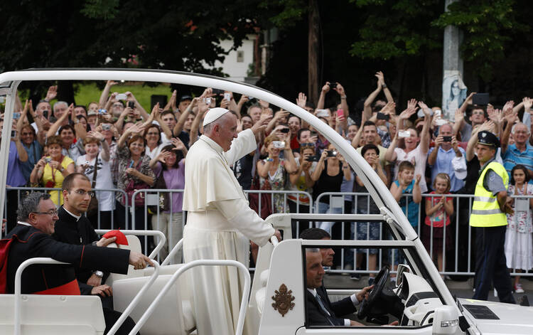 Pope Francis greets crowd as he arrives for meeting with young people in Sarajevo, Bosnia-Herzegovina.