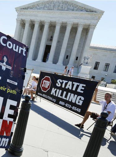 Protesters against the death penalty gather in front of the U.S. Supreme Court building in Washington June 29. (CNS photo/Jonathan Ernst, Reuters)