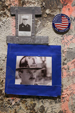 Photo of firefighter and Father Mychal Judge seen on beam at National September 11 Memorial & Museum in New York City