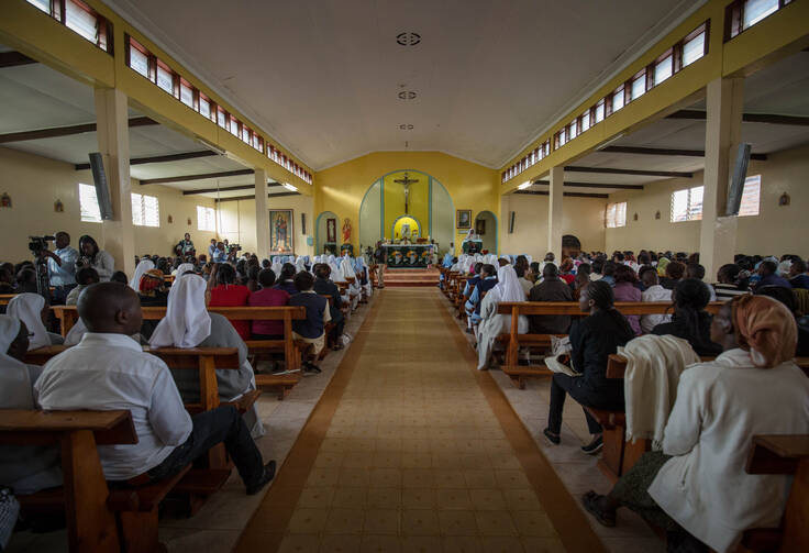 Worshippers pray inside a Catholic church in Nyeri, Kenya, in May 2015. (CNS photo/Stuart Price, EPA)