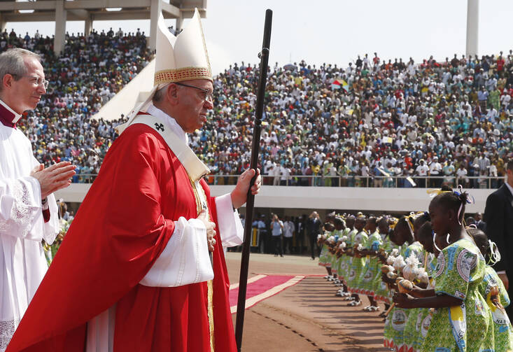 Pope Francis arrives in procession to celebrate Mass at Barthelemy Boganda Stadium in Bangui, Central African Republic, Nov. 30. (CNS photo/Paul Haring)