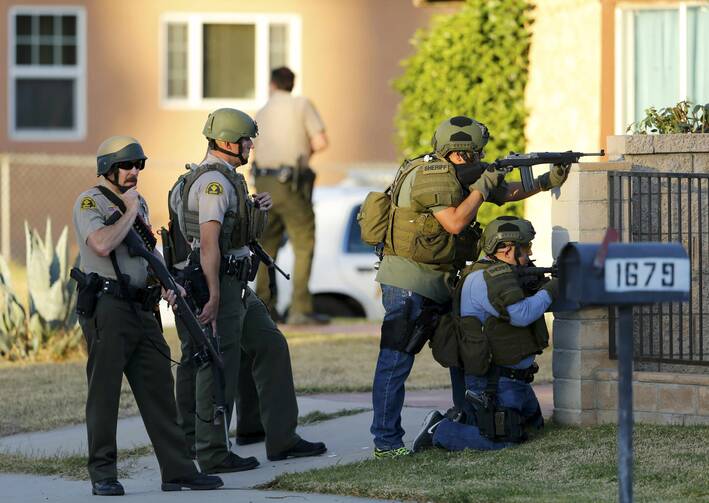 Police officers conduct a manhunt after a mass shooting in San Bernardino, Calif., on Dec. 2. (CNS photo/Mike Blake, Reuters)