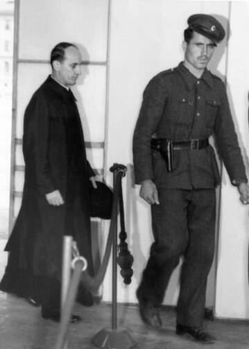 Blessed Alojzije Stepinac enters a Zagreb courtroom in 1946. Stepinac, who has been accused of being a Nazi sympathizer, is currently being studied by Croatian and Serbian experts who hope to clear up questions about his life. (CNS file photo)