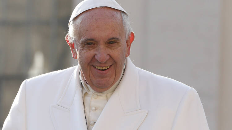 Pope Francis smiles as he arrives to lead his general audience in St. Peter's Square at the Vatican Dec. 16. The pope won the German 2016 Charlemagne Prize for European unification. (CNS photo/Paul Haring)