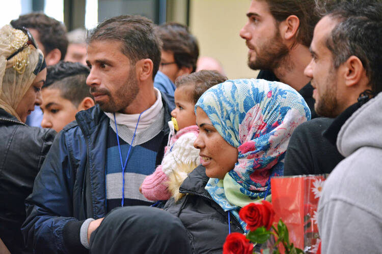 Syrian refugees are seen at Fiumicino Airport in Rome Feb. 29. (CNS photo/EPA)