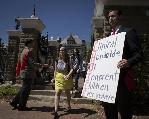 Pro-life demonstrators gather outside the campus of Georgetown University in Washington April 20. (CNS photo/Tyler Orsburn)