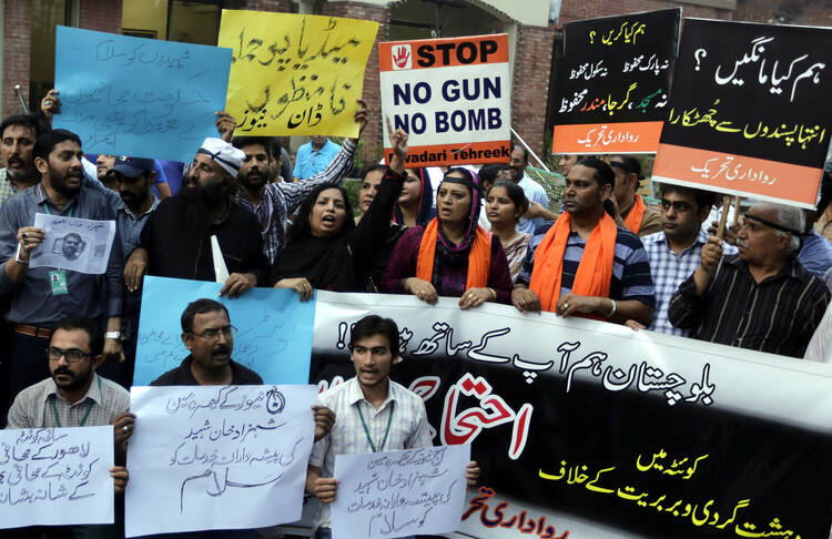 Pakistani journalists in Lahore, Pakistan, protest a bombing Aug. 8 that killed at least 70 people in Quetta. (CNS photo/Rahat Dar, EPA)