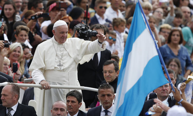 Argentina's flag is seen as Pope Francis arrives to lead his general audience in St. Peter's Square at the Vatican on Sept. 7. (CNS photo/Paul Haring)