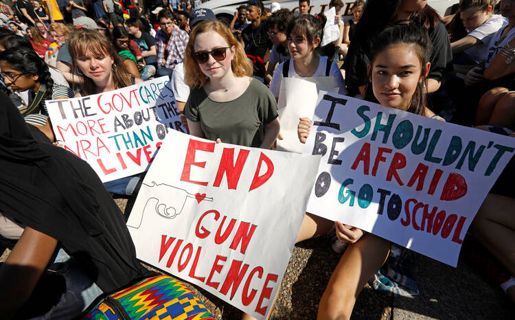 Students who walked out of classes from Montgomery County Public Schools in Maryland protest against gun violence in front of the White House on Feb. 21 in Washington. (CNS photo/Kevin Lamarque, Reuters)