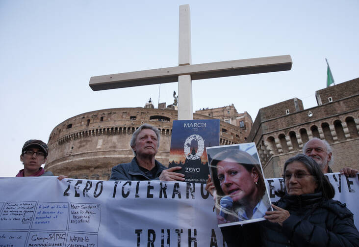 Clerical sex abuse survivors and their supporters rally outside Castel Sant'Angelo in Rome on Feb. 21. (CNS photo/Paul Haring) 