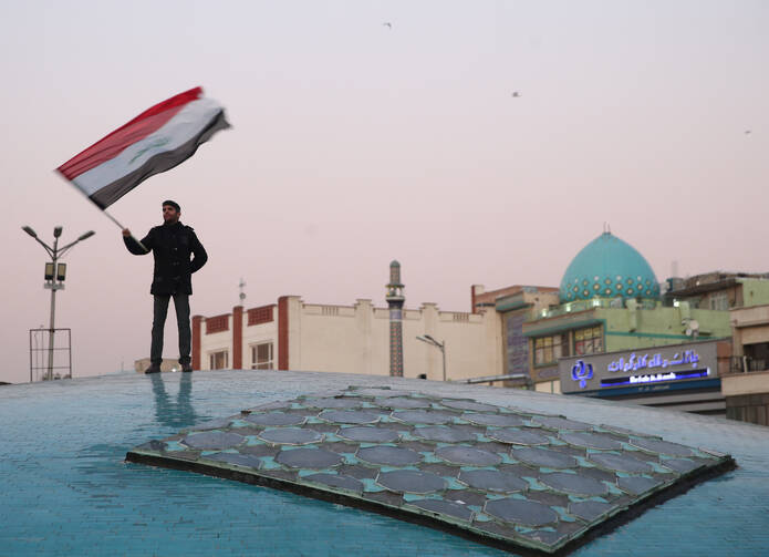 A man celebrates in Tehran, Iran, on Jan. 8, 2020, after the country launched missiles at U.S.-led forces in Iraq. (CNS photo/Nazanin Tabatabaee, West Asia News Agency via Reuters)