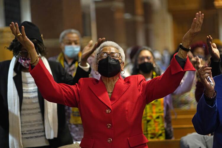 A woman prays during a Black History Month Mass at Immaculate Conception Church in the Jamaica Estates section of Queens, New York City, on Feb. 20, 2022. (CNS photo/Gregory A. Shemitz)