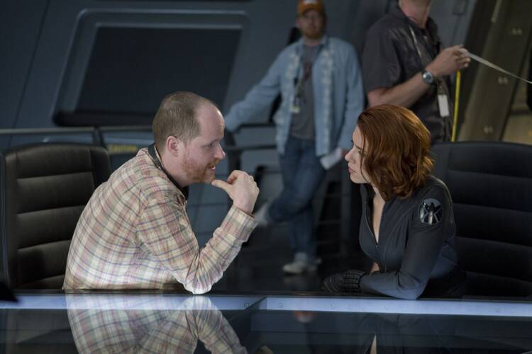 Director Joss Whedon and Scarlett Johansson as Black Widow