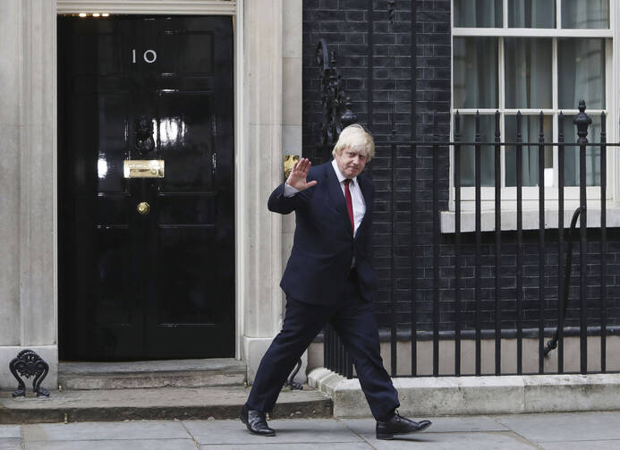 Boris Johnson leaves 10 Downing Street after being appointed Foreign Secretary, following a Cabinet reshuffle by new Prime Minister Theresa May, in London on July 13. (Steve Parsons/PA via AP)