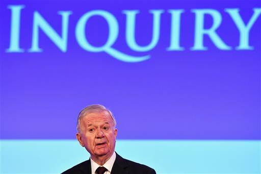 John Chilcot presents the Iraq Inquiry Report at the Queen Elizabeth II Centre in London, Wednesday, July 6, 2016 (Jeff J Mitchell/Pool via AP).