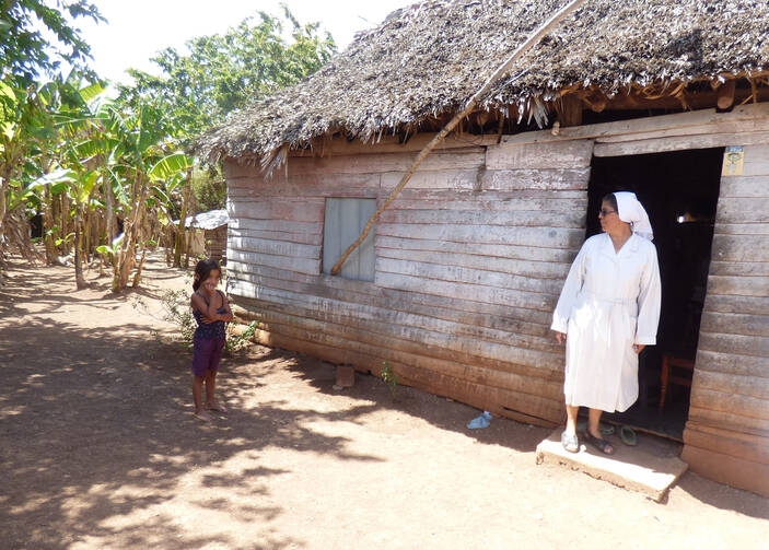 Sister Olga Arias visits a family of nine, including seven children, in early March in rural Cuba. It can be daunting to transmit the values of the church when families are focused on day-by-day survival, she said. (CNS photo/Rhina Guidos)