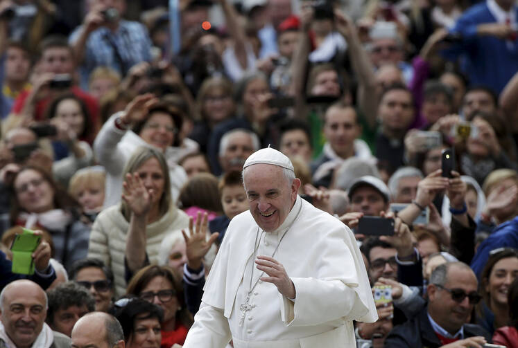 Pope Francis waves as he arrives to lead his weekly audience in St. Peter's Square at the Vatican, Sept. 30 (CNS photo/Max Rossi, Reuters).
