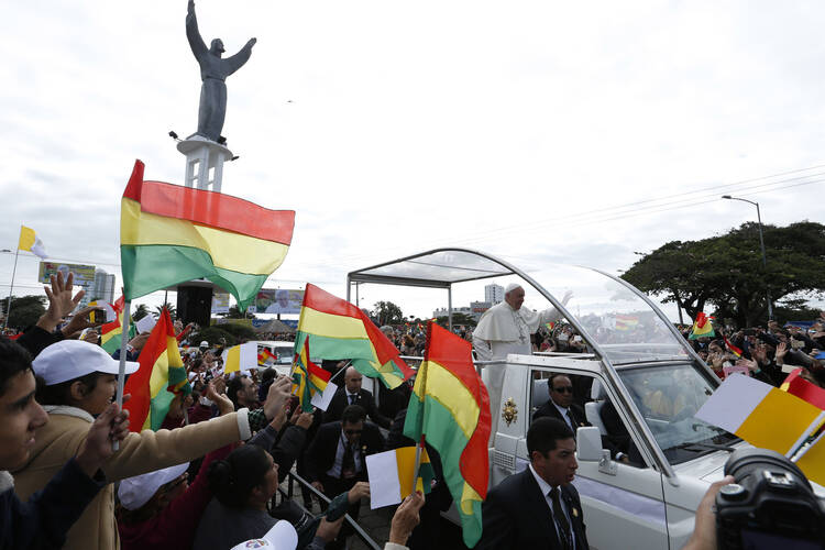 Pope Francis greets the crowd as he arrives to celebrate Mass in Christ the Redeemer Square in Santa Cruz, Bolivia, July 9. (CNS photo/Paul Haring) 
