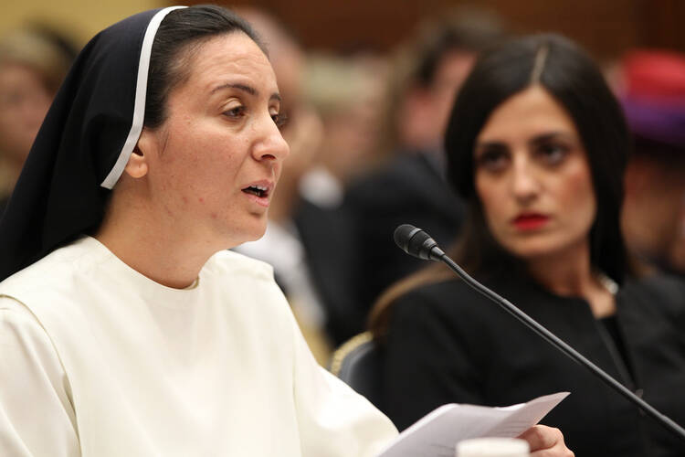 Sister Diana Momeka, a member of the Dominican Sisters of St. Catherine of Siena in Mosul, Iraq, testifies at a May 13 hearing on Capitol Hill (CNS photo/ Bob Roller).
