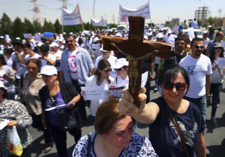Hundreds of Iraqi Christians marched to the United Nations office in Irbil on July 24, calling for help for families who fled in the face of threats by Islamic State militants.
