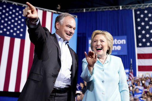 Democratic presidential candidate Hillary Clinton and Sen. Tim Kaine, D-Va., arrive at a rally at Florida International University Panther Arena in Miami, Saturday, July 23, 2016. (AP Photo/Andrew Harnik)