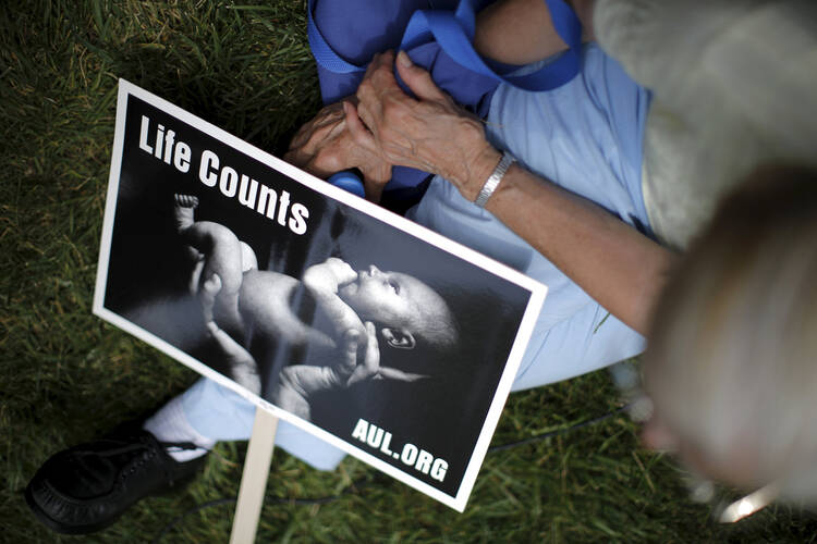 Life Counts at a "Women Betrayed" rally to Defund Planned Parenthood on Capitol Hill in Washington July 28. (CNS photo/Carlos Barria, Reuters)
