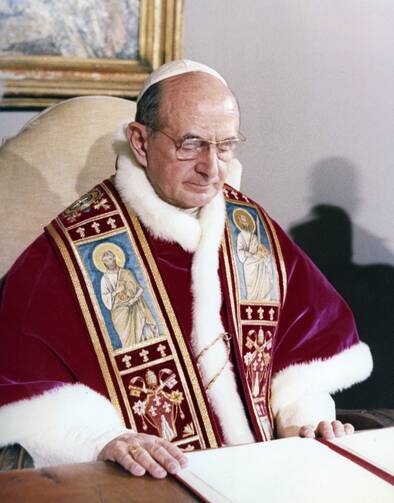 Pope Paul VI featured at his desk in the Vatican.