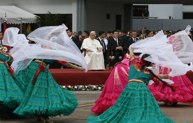 Dancers perform as Pope Francis arrives at Silvio Pettirossi International Airport in Asuncion, Paraguay, July 10 (CNS photo/Paul Haring).