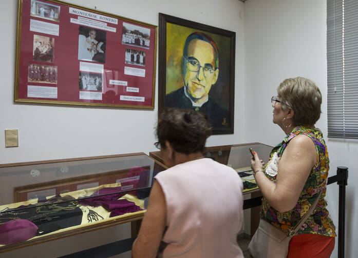Women look at relics and other items of Salvadoran Archbishop Oscar Romero March 22 at a museum dedicated to the late archbishop at Divine Providence Hospital in San Salvador. (CNS photo/Octavio Duran)