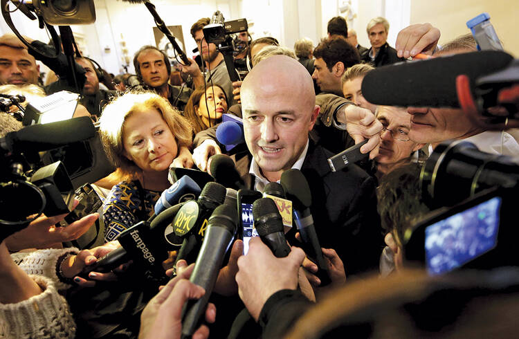 FULL PRESS. Italian journalist Gianluigi Nuzzi is surrounded by the media after a news conference for his new book Merchants in the Temple on Nov. 4. 