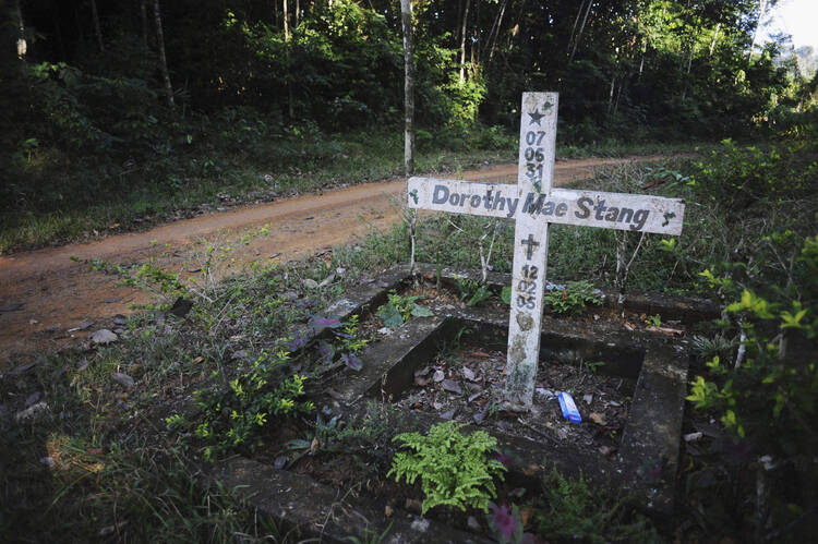 A cross stands on the spot where U.S. Sister Dorothy Stang, a member of the Sisters of Notre Dame de Namur, was murdered Feb. 12, 2005, on an isolated road near the Brazilian town of Anapu. (CNS photo/Lunae Parracho, Reuters)