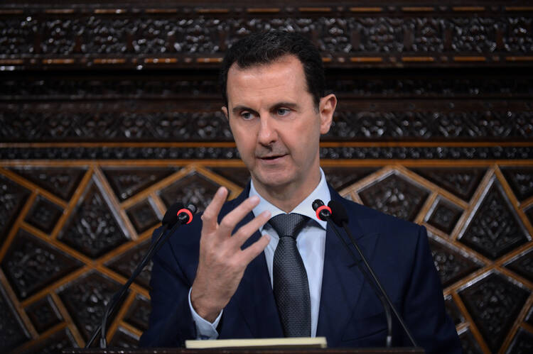 Syrian President Bashar Assad speaks in Damascus on June 7. Removing Assad from power has been a U,S, objective even before the rise of ISIS. (SANA via AP)