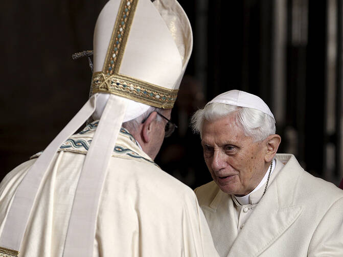 Pope Francis, left, meets Emeritus Pope Benedict XVI before opening the Holy Door to mark the opening of the Catholic Holy Year, or Jubilee, in St. Peter's Basilica, at the Vatican, on Dec. 8, 2015. Photo courtesy of REUTERS/Max Rossi 