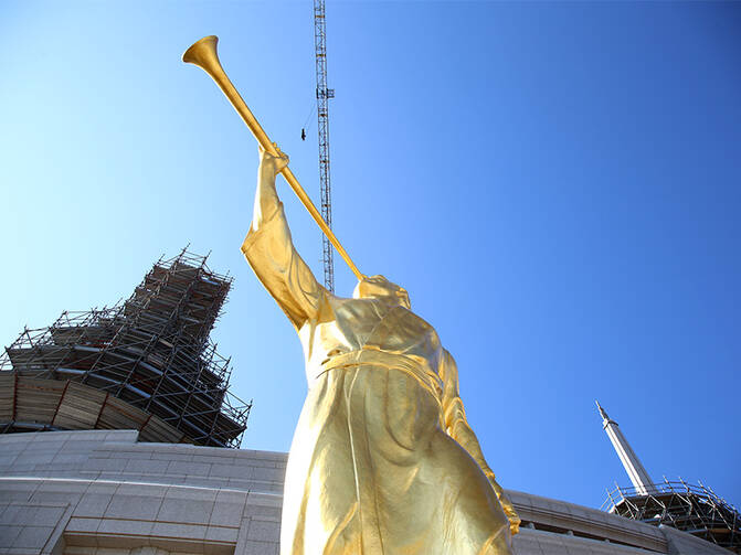 A gold-leaf statue depicting the ancient Mormon prophet, Moroni, is prepared for placement on one of the spires of the new Mormon temple in Rome on March 25, 2017. Photo courtesy of Claudio Falanga/Intellectual Reserve Inc.