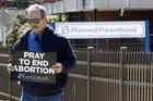 Pro-life advocate Joe San Pietro participates in a 40 Days for Life vigil near the entrance to a Planned Parenthood center in Smithtown, N.Y., on March 26. (CNS photo/Gregory A. Shemitz)