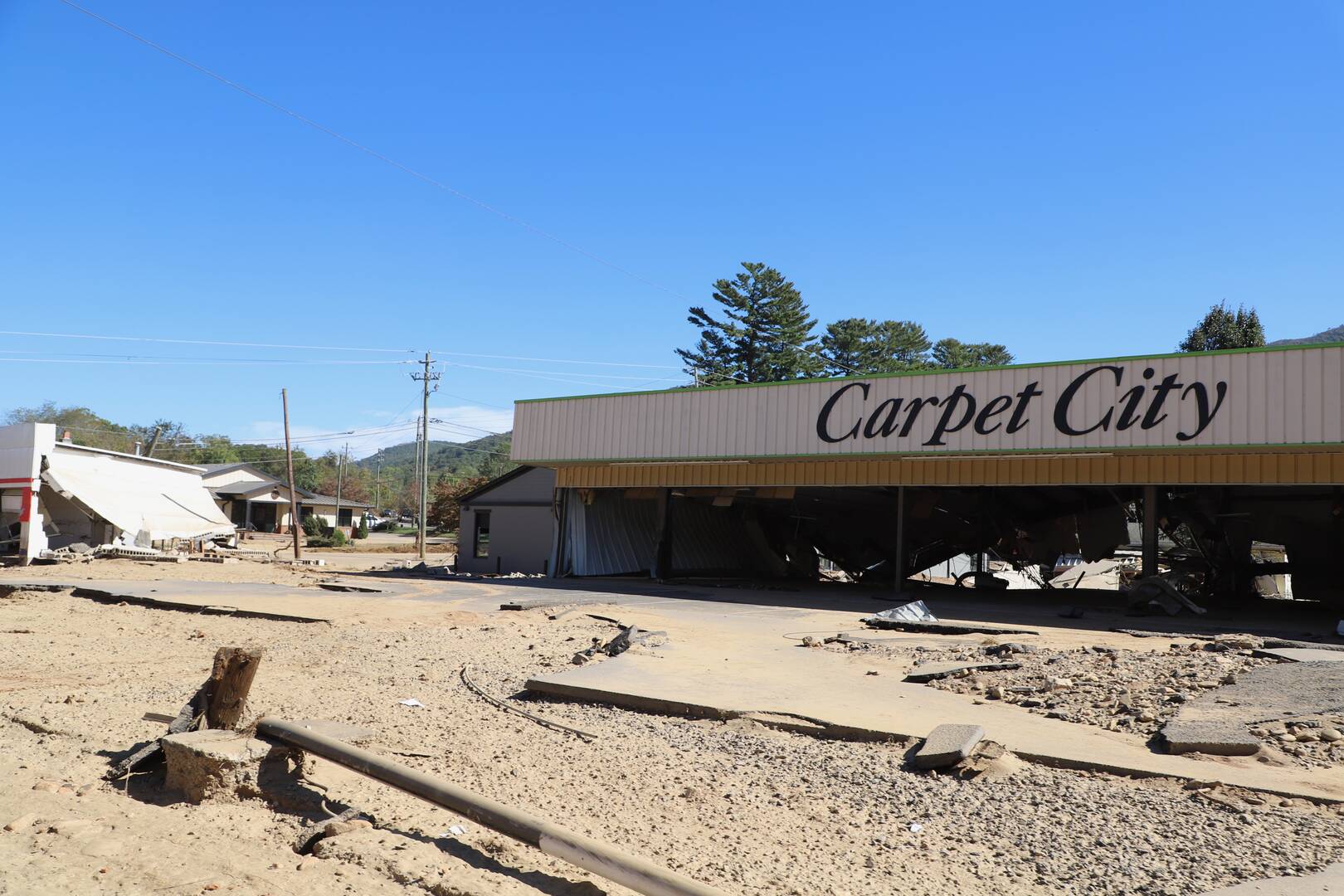 Damaged commercial sites along Swannanoa River Road in Asheville, N.C.