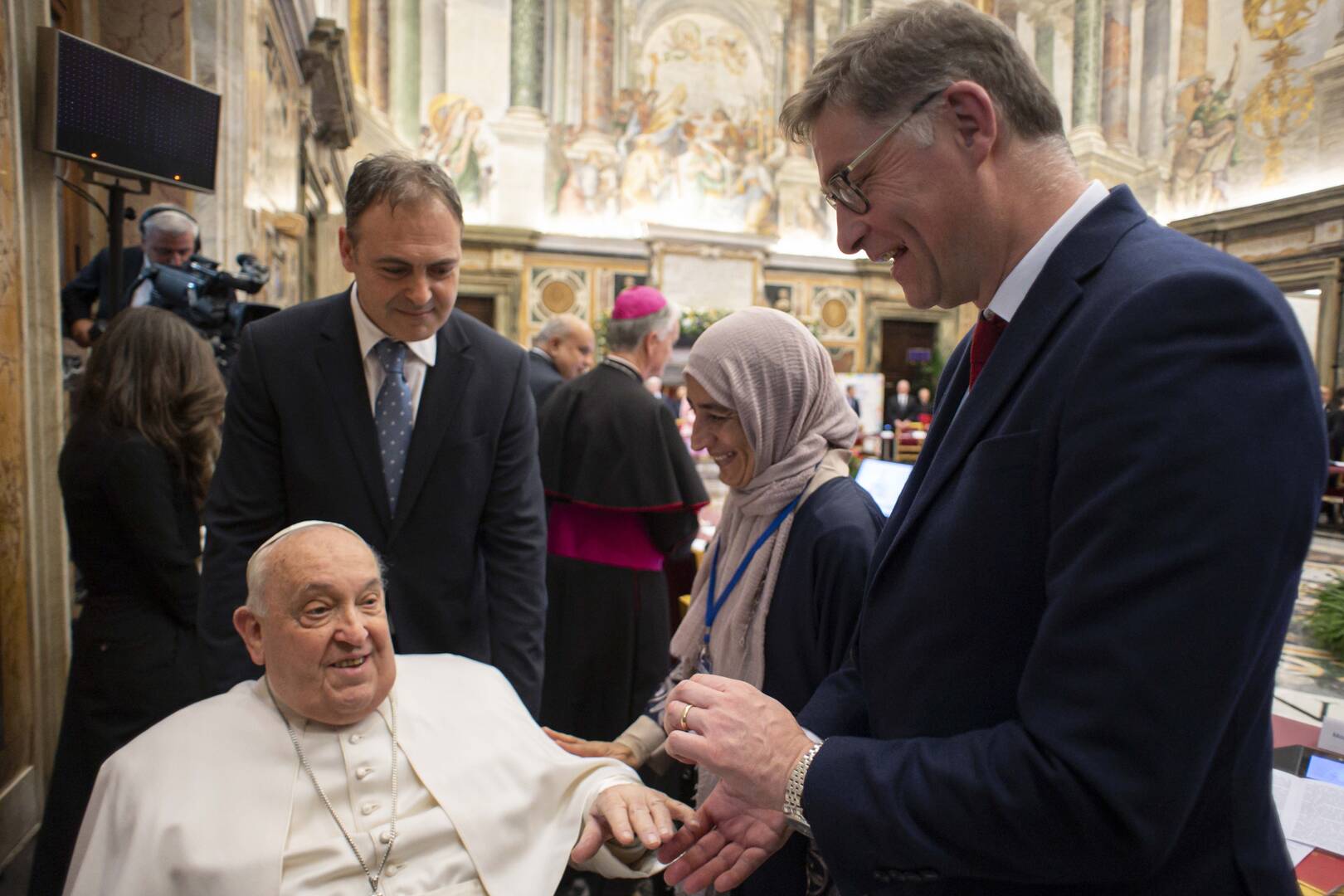 Pope Francis greets Magnus MacFarlane-Barrow, the Scottish founder of Mary's Meals, which feeds more than 2.5 million children each day, during the International Summit on Children's Rights at the Vatican Feb. 3, 2025. (CNS photo/Vatican Media)