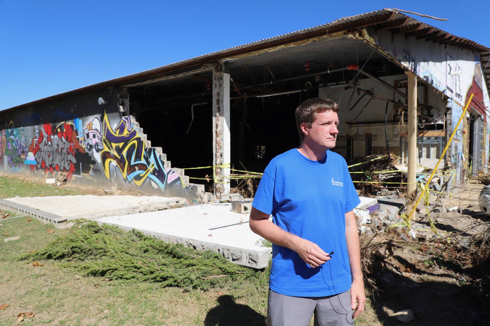 Jesse Boeckermann of Catholic Charities - Asheville surveys the scene at Foundy Street.