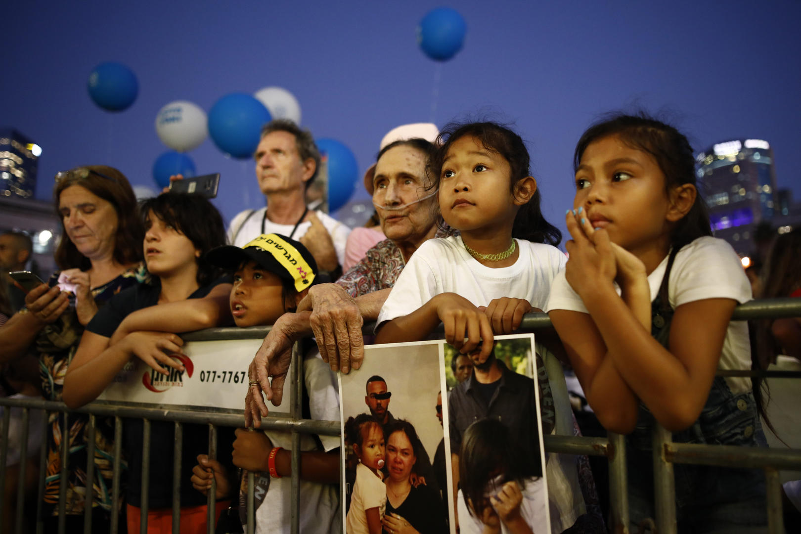 People attend a rally in Tel Aviv on Aug. 6.